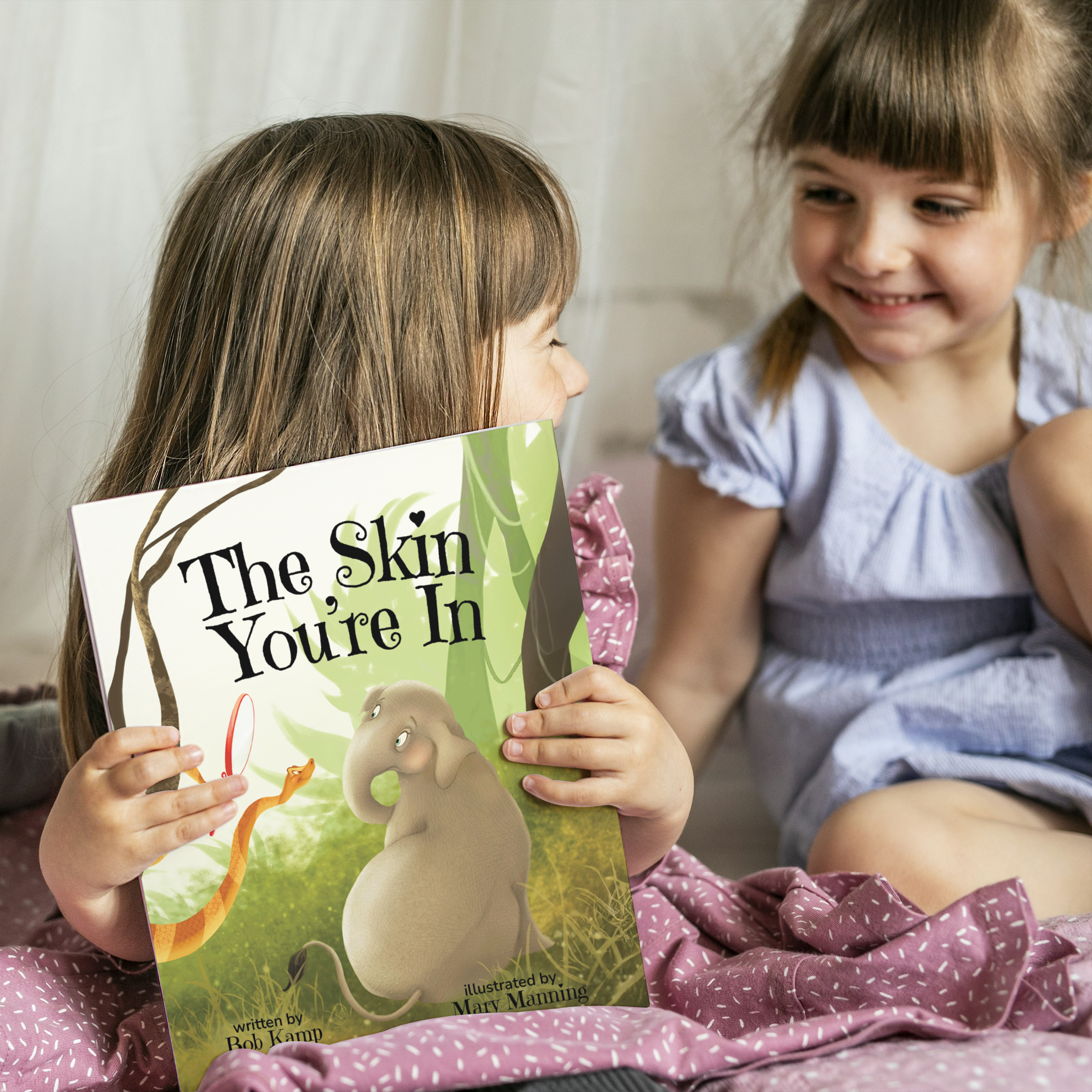 Two Girls Holding A Children's Book Called The Skin You're In.